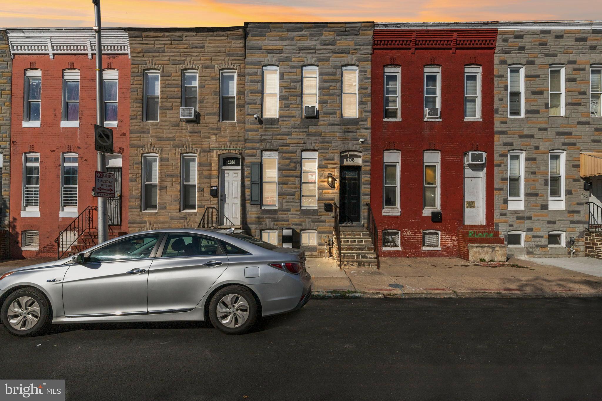 406 South Smallwood Street Baltimore, MD 21223 - Photo 1 of 18 a car parked in front of a building