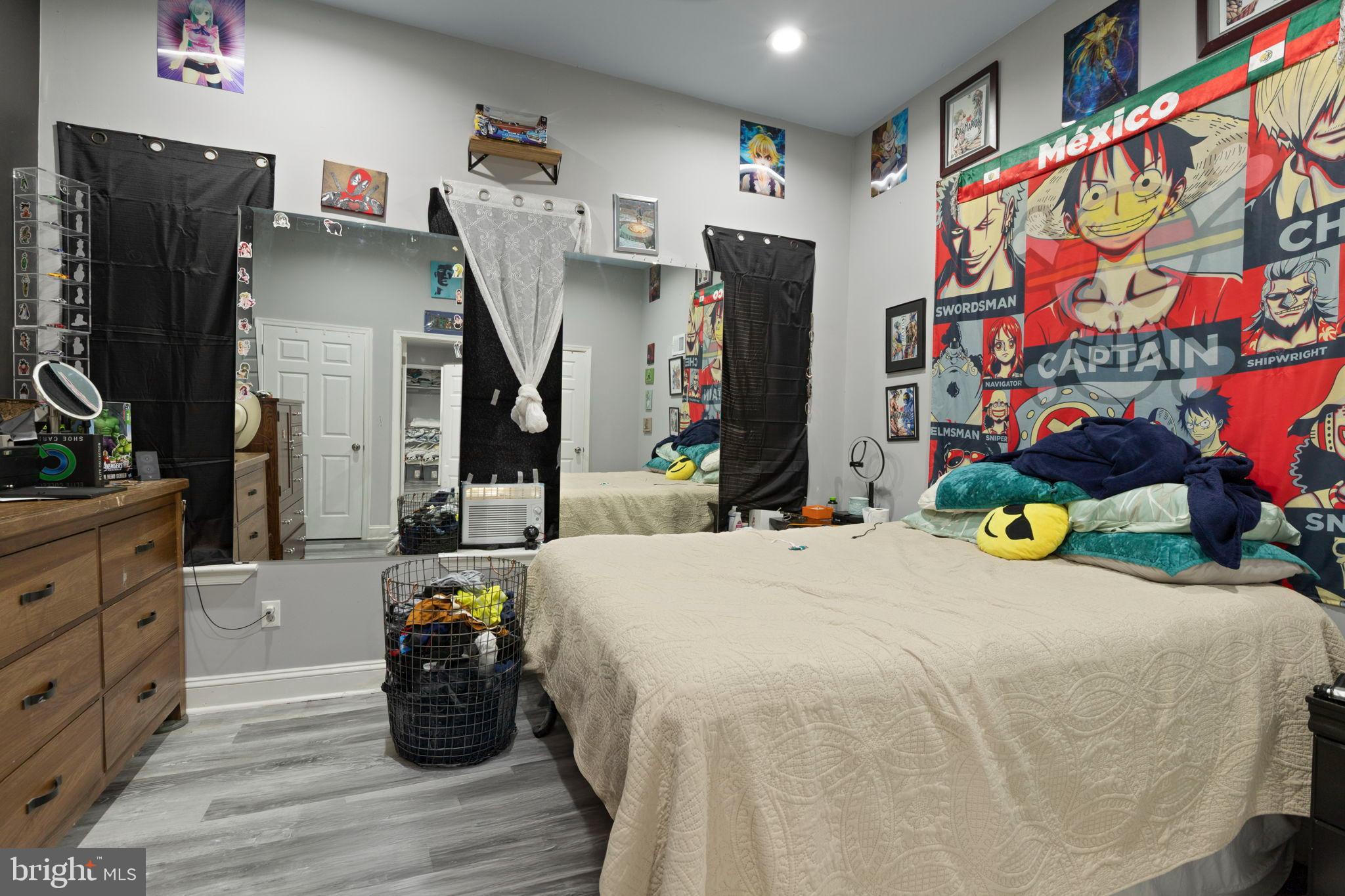 406 South Smallwood Street Baltimore, MD 21223 - Photo 12 of 18 a bed room with a bed and a tv