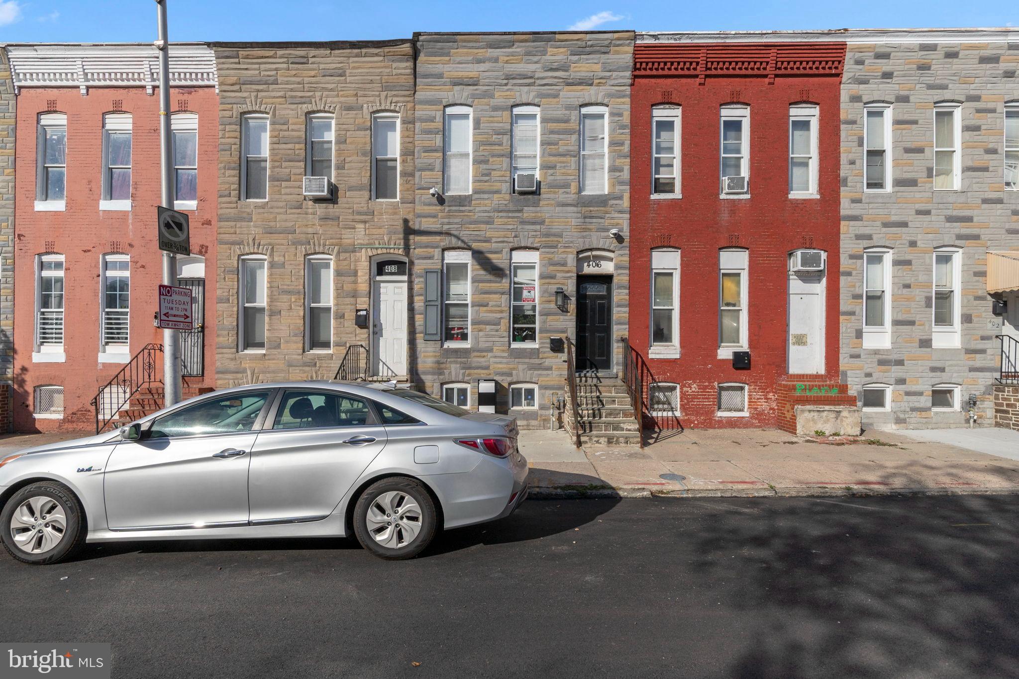 406 South Smallwood Street Baltimore, MD 21223 - Photo 2 of 18 a view of a car in front of a building