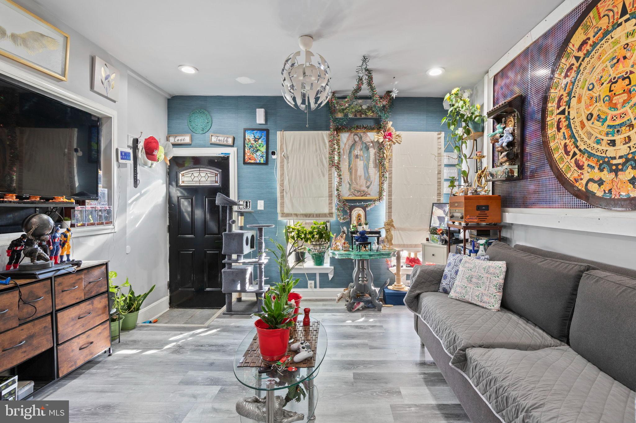 406 South Smallwood Street Baltimore, MD 21223 - Photo 4 of 18 a living room with lots of furniture and chandelier