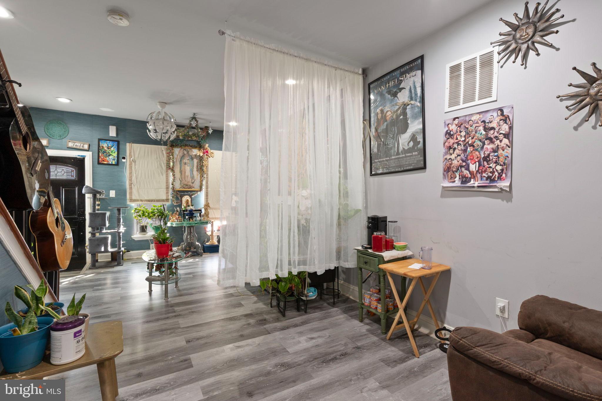 406 South Smallwood Street Baltimore, MD 21223 - Photo 5 of 18 a living room with furniture and wooden floor