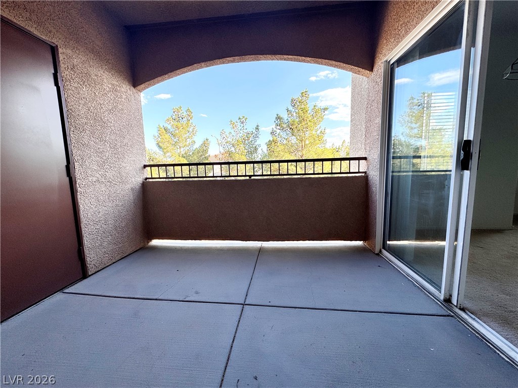 9580 West Reno Avenue, Unit 242 Las Vegas, NV 89148 - Photo 22 of 26 An inviting balcony space with a scenic view, perfect for relaxation or outdoor dining.