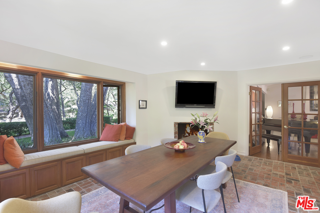 6138 Ramirez Canyon Road Malibu, CA 90265 - Photo 14 of 42 a living room with furniture and a flat screen tv