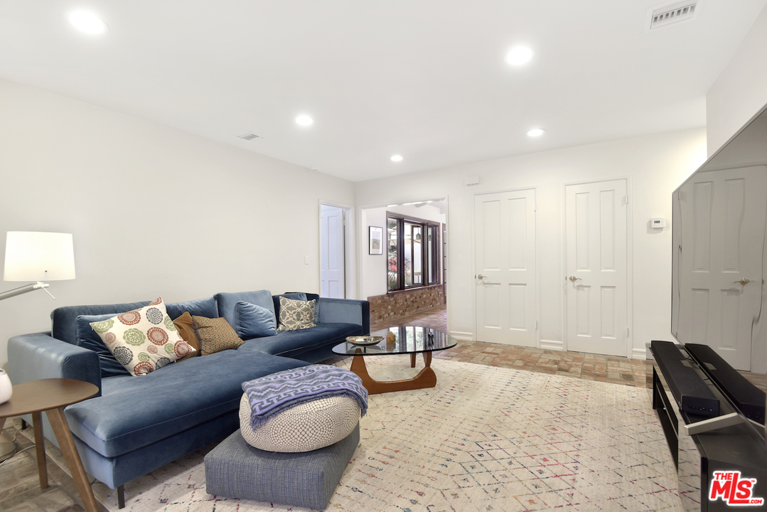 6138 Ramirez Canyon Road Malibu, CA 90265 - Photo 17 of 42 a living room with furniture and a rug