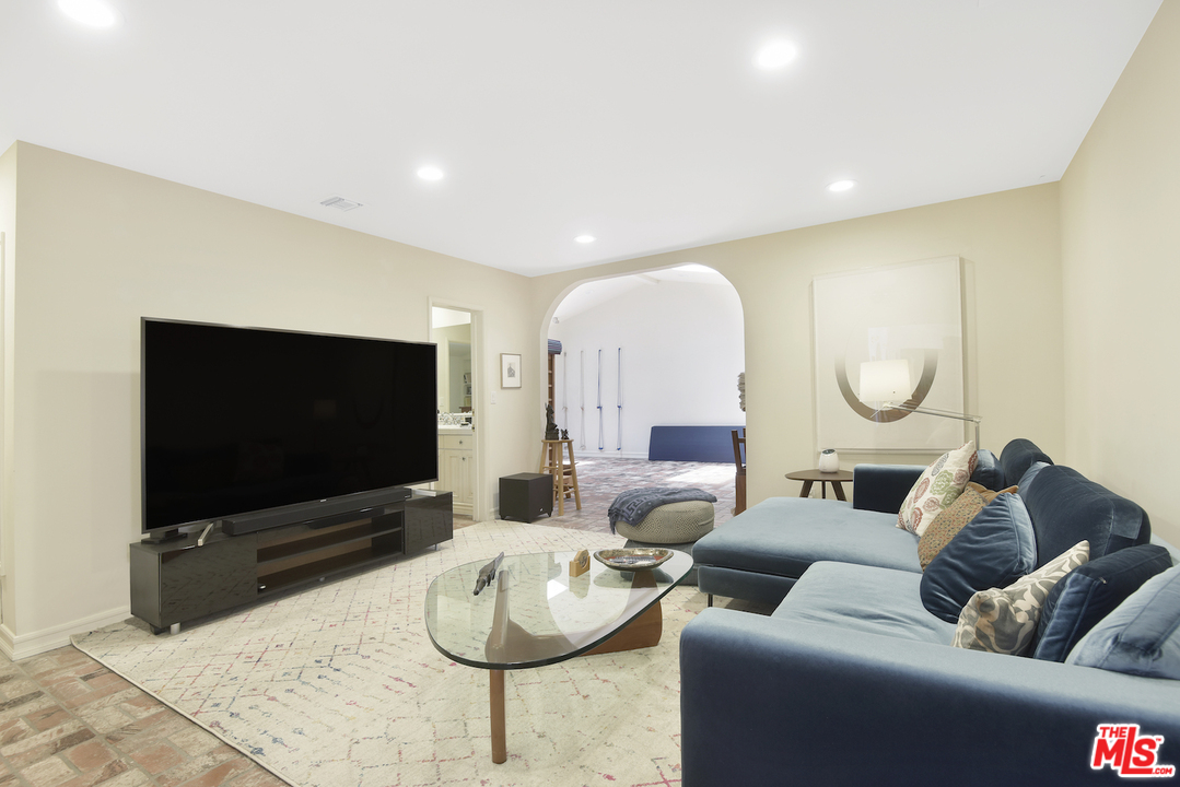 6138 Ramirez Canyon Road Malibu, CA 90265 - Photo 18 of 42 a living room with furniture and a flat screen tv