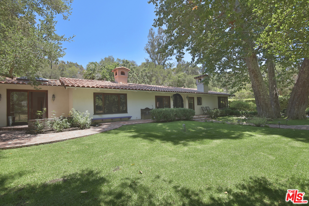 6138 Ramirez Canyon Road Malibu, CA 90265 - Photo 4 of 42 a view of a house with a back yard