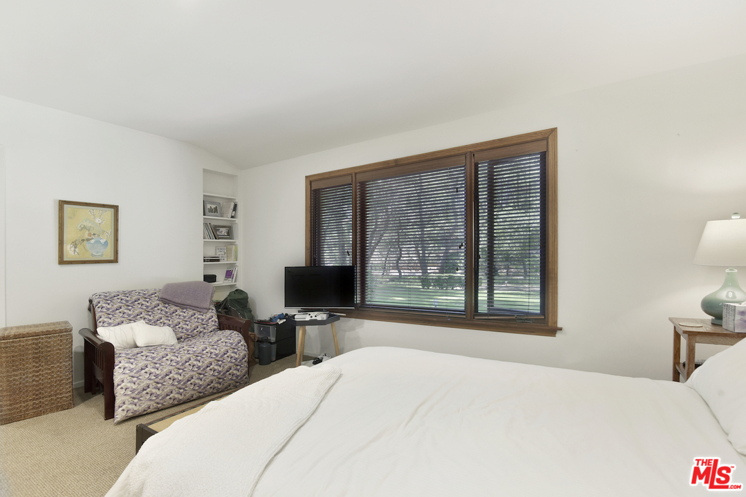 6138 Ramirez Canyon Road Malibu, CA 90265 - Photo 34 of 42 a bedroom with furniture and a window