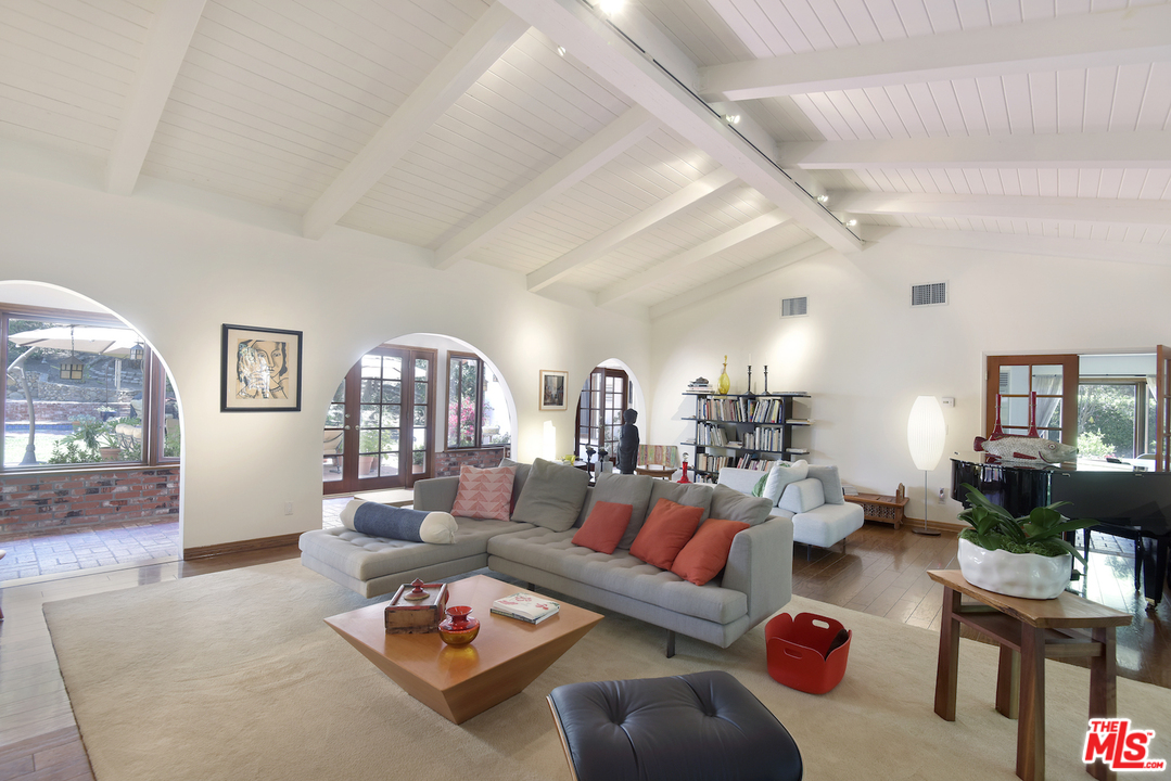 6138 Ramirez Canyon Road Malibu, CA 90265 - Photo 5 of 42 a living room with furniture or couch and a dining table