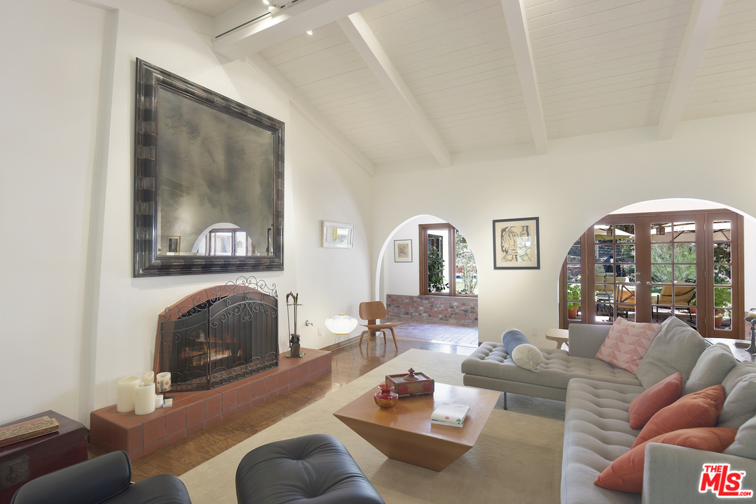 6138 Ramirez Canyon Road Malibu, CA 90265 - Photo 7 of 42 a living room with furniture and a fireplace