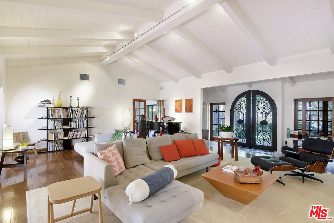 6138 Ramirez Canyon Road Malibu, CA 90265 - Photo 8 of 42 a living room with furniture a rug and a large window