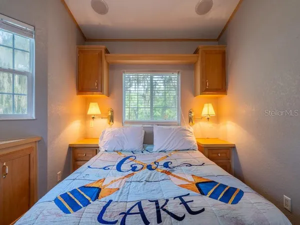 a bedroom with furniture and a window