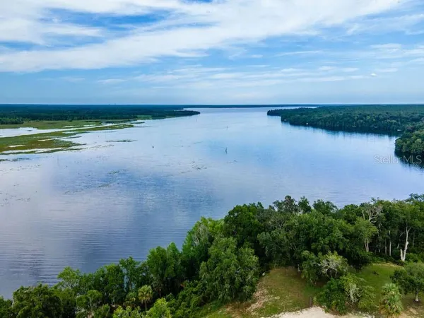 a view of a lake with a yard
