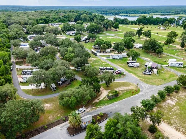 an aerial view of a house with yard