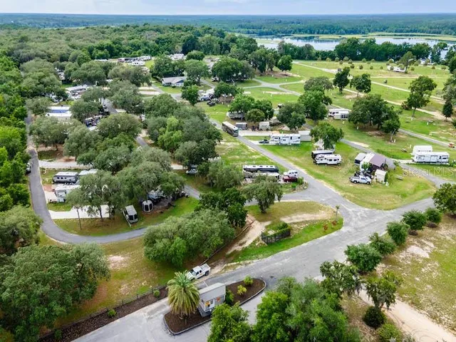 an aerial view of a house with yard