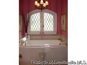 301 Summertime Road Fayetteville, NC 28303 - Photo 11 of 25 a bath tub sitting next to a window