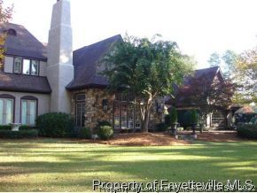 301 Summertime Road Fayetteville, NC 28303 - Photo 23 of 25 a view of swimming pool in front of residential houses