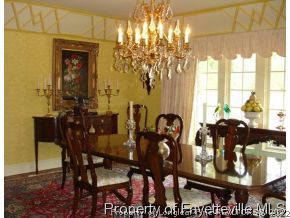 301 Summertime Road Fayetteville, NC 28303 - Photo 7 of 25 a view of a dining room with furniture and chandelier