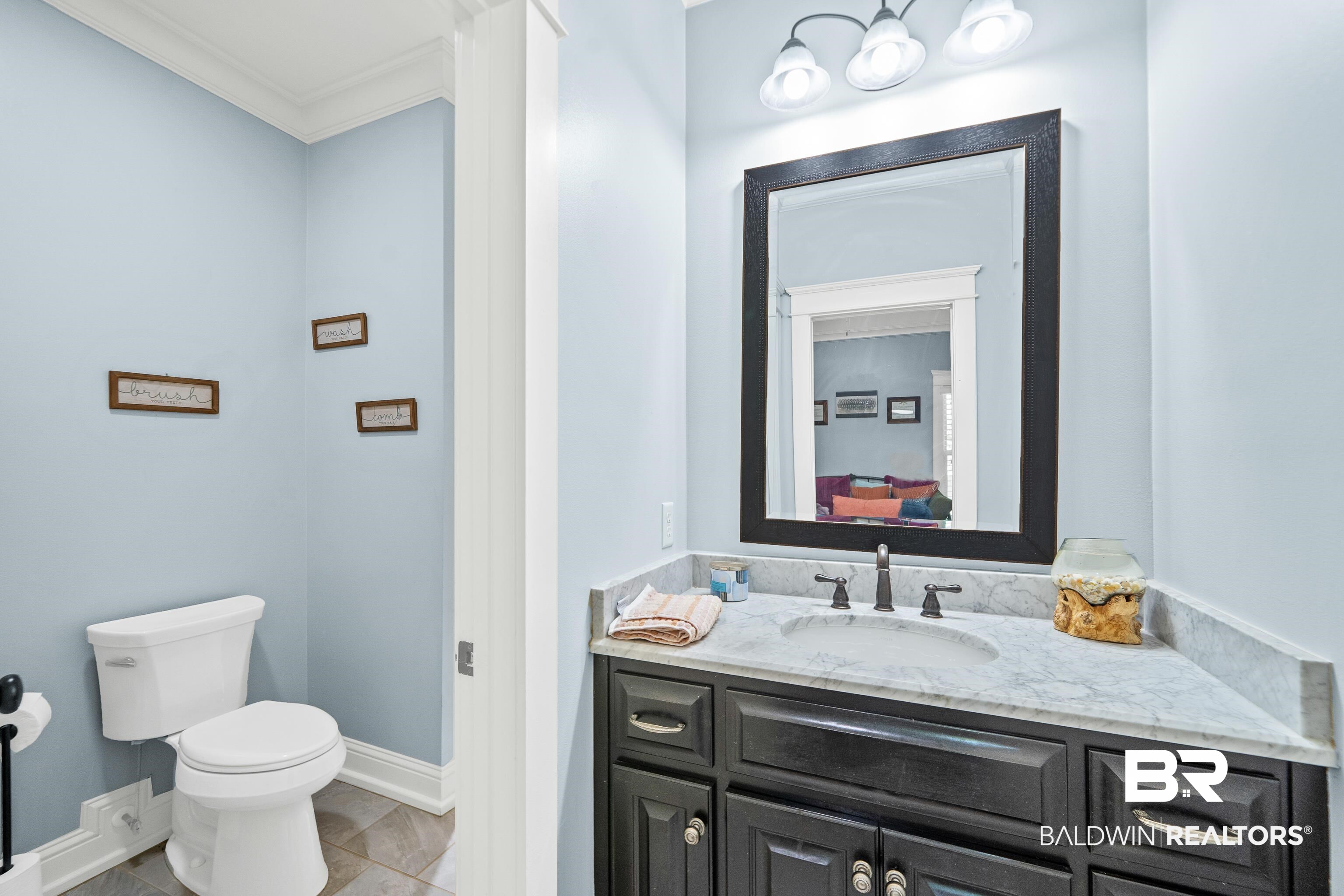 31829 Butler Drive Daphne, AL 36527 - Photo 32 of 48 Bathroom featuring ornamental molding, vanity, tile patterned flooring, and toilet