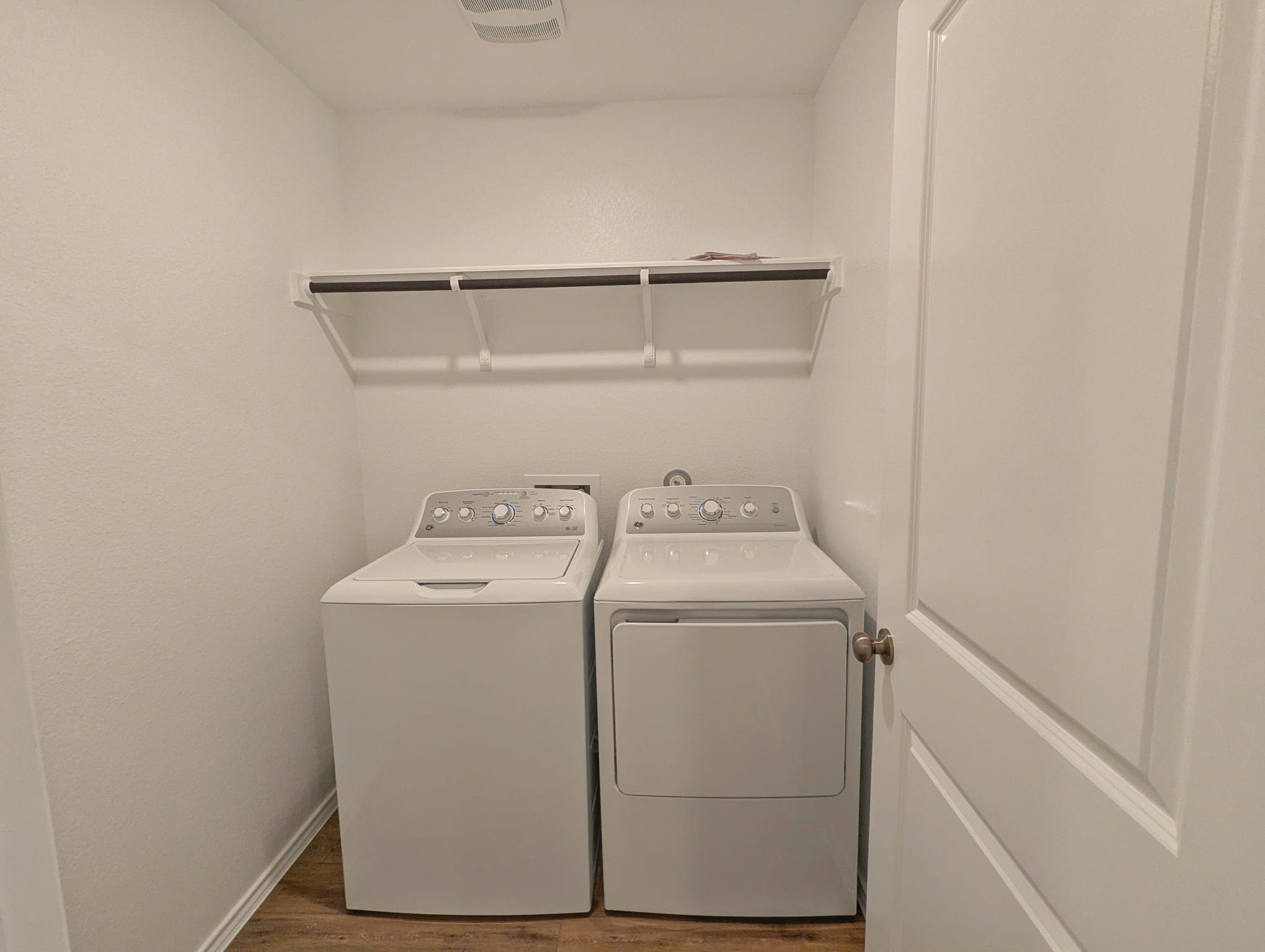 1504 Marley Kyle, TX 78640 - Photo 15 of 28 Laundry area featuring wood finished floors and washing machine and dryer