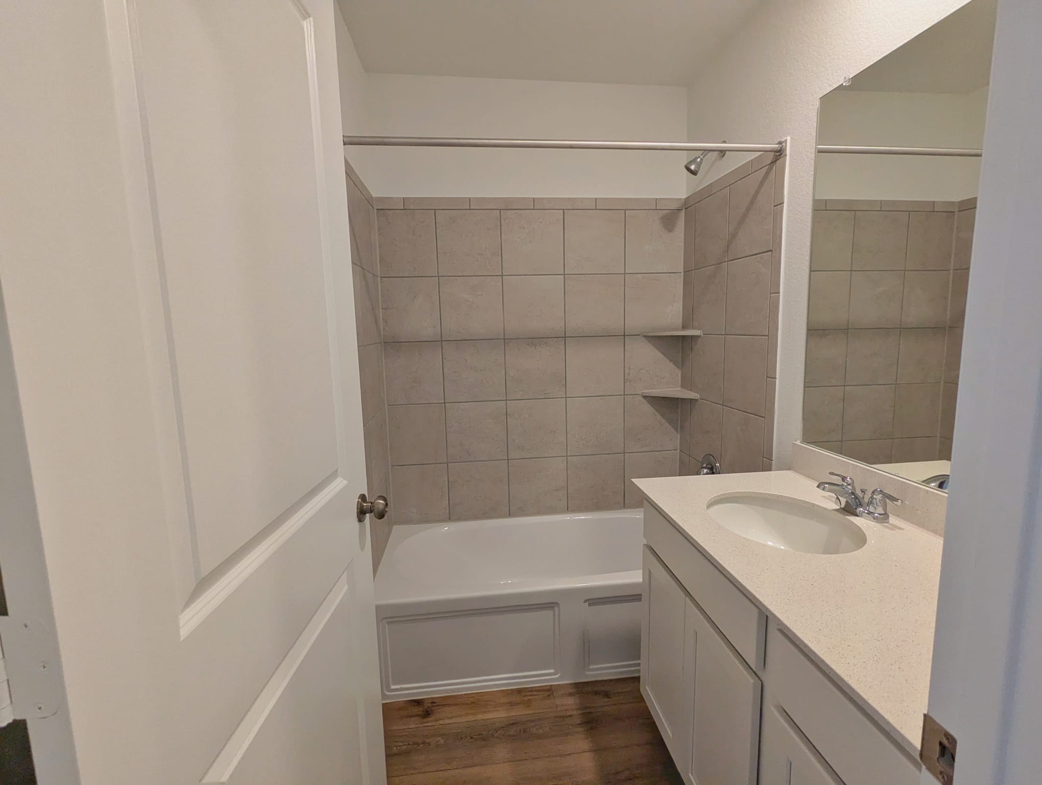1504 Marley Kyle, TX 78640 - Photo 20 of 28 Full bath with vanity, bathtub / shower combination, and dark wood-style floors