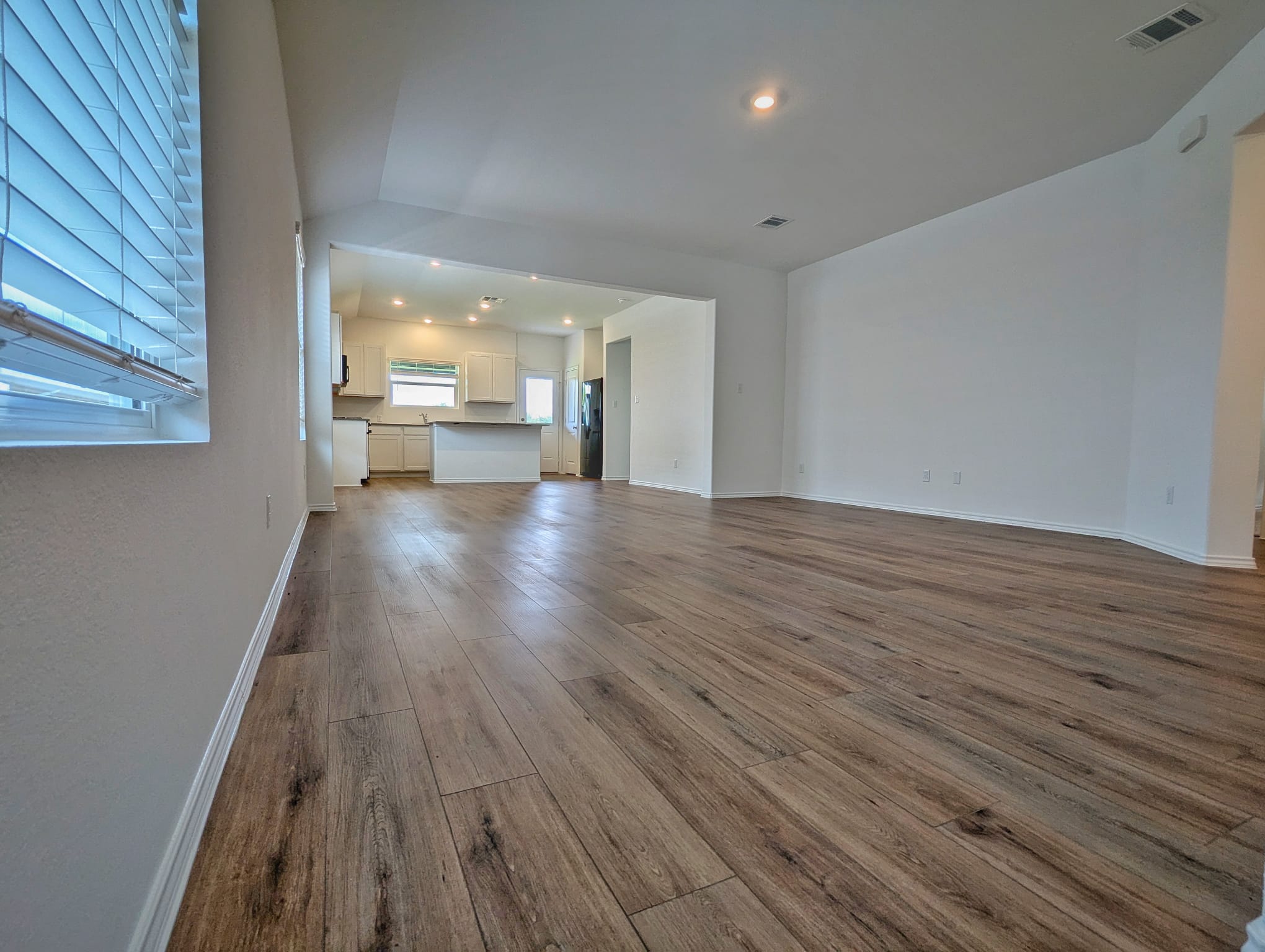 1504 Marley Kyle, TX 78640 - Photo 5 of 28 Unfurnished living room with recessed lighting and light wood-type flooring