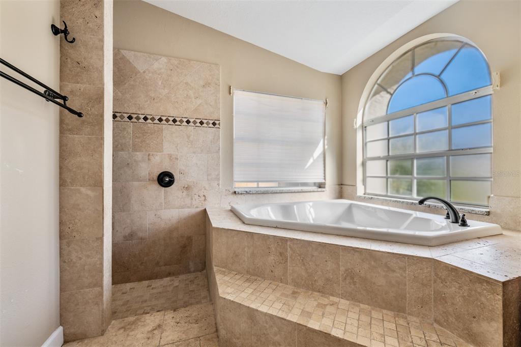 5315 Saltamonte Drive New Port Richey, FL 34655 - Photo 17 of 26 a bath tub sitting next to a bathroom sink