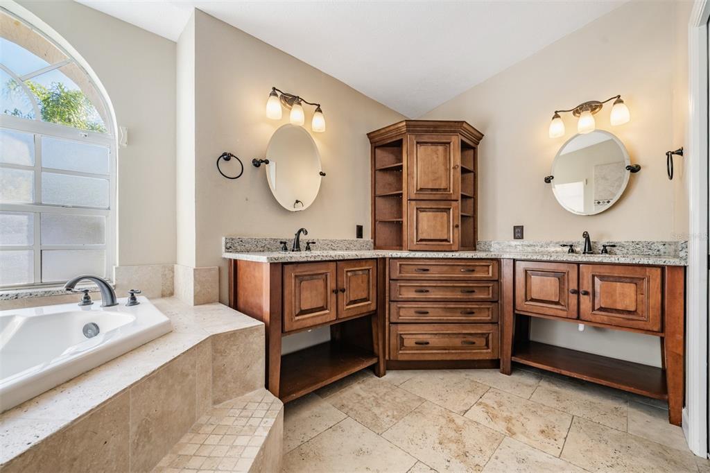 5315 Saltamonte Drive New Port Richey, FL 34655 - Photo 18 of 26 a bathroom with a double vanity sink and a mirror