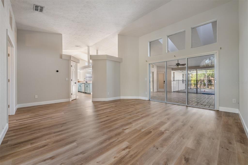 5315 Saltamonte Drive New Port Richey, FL 34655 - Photo 2 of 26 a view of empty room with wooden floor and fan