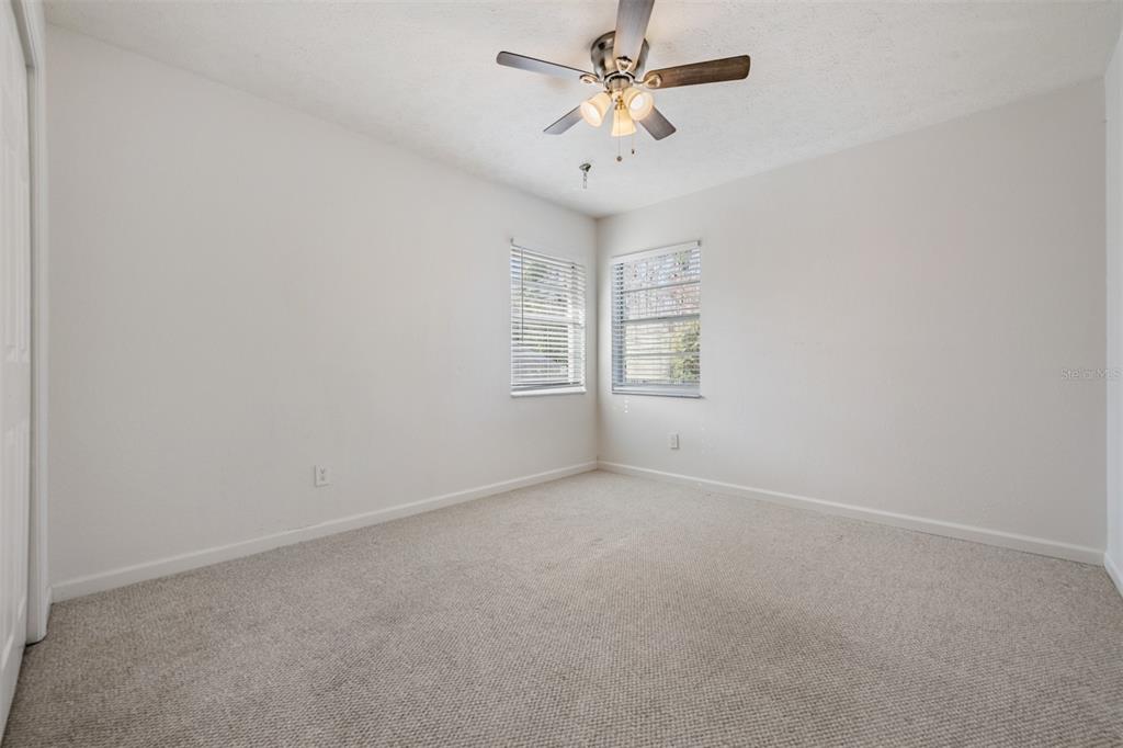 5315 Saltamonte Drive New Port Richey, FL 34655 - Photo 21 of 26 an empty room with a window and ceiling fan
