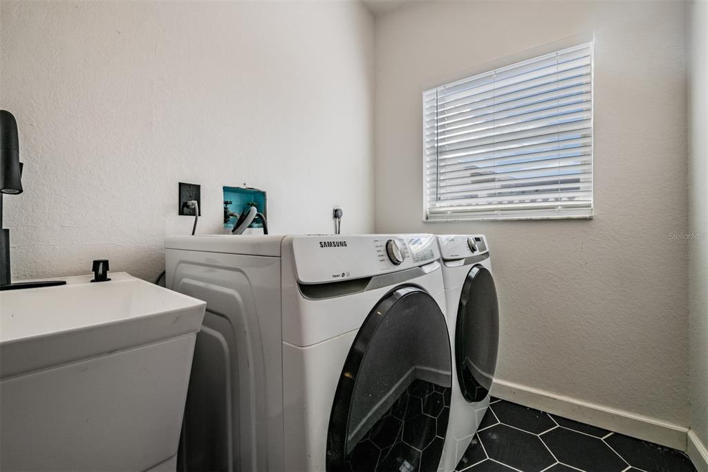 5315 Saltamonte Drive New Port Richey, FL 34655 - Photo 22 of 26 a utility room with dryer and washer