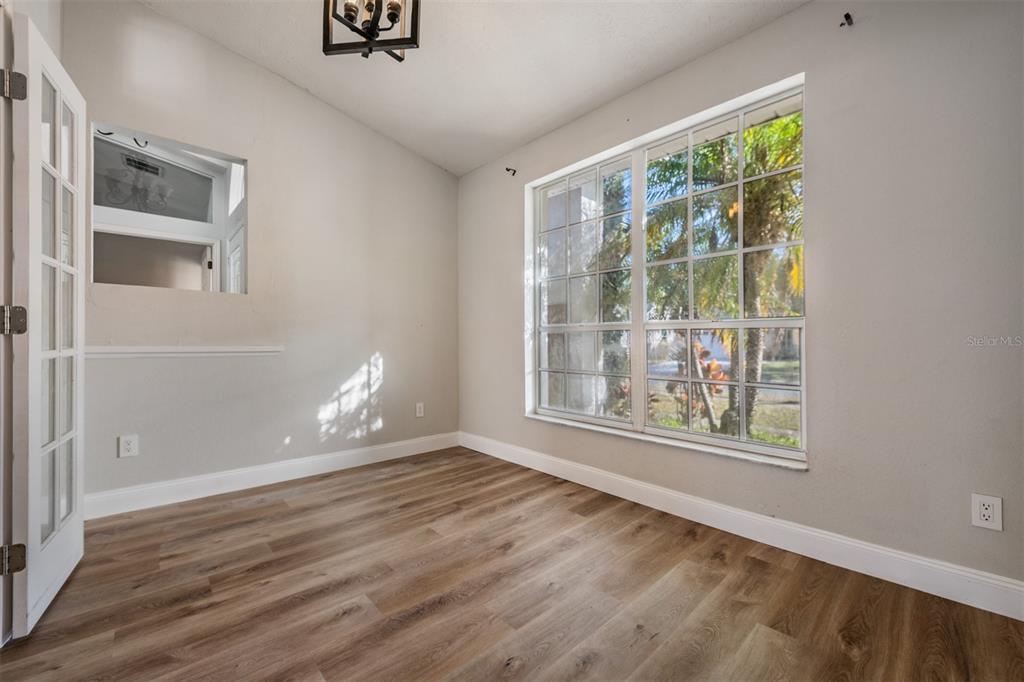 5315 Saltamonte Drive New Port Richey, FL 34655 - Photo 4 of 26 an empty room with wooden floor and windows