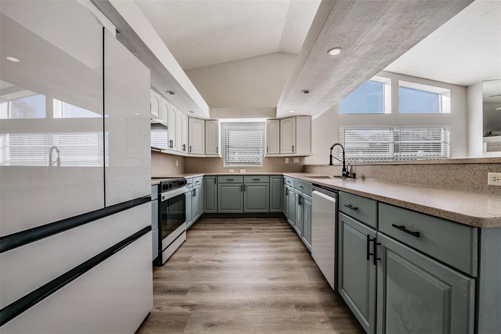 5315 Saltamonte Drive New Port Richey, FL 34655 - Photo 7 of 26 a kitchen with stainless steel appliances granite countertop a sink and cabinets
