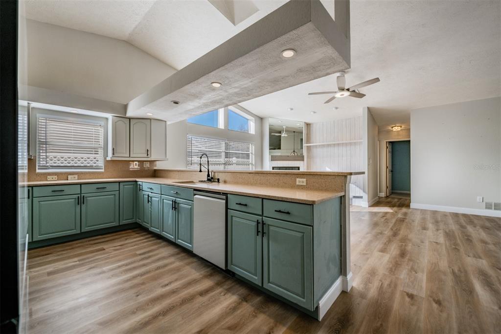 5315 Saltamonte Drive New Port Richey, FL 34655 - Photo 8 of 26 a kitchen with granite countertop a sink cabinets and wooden floor
