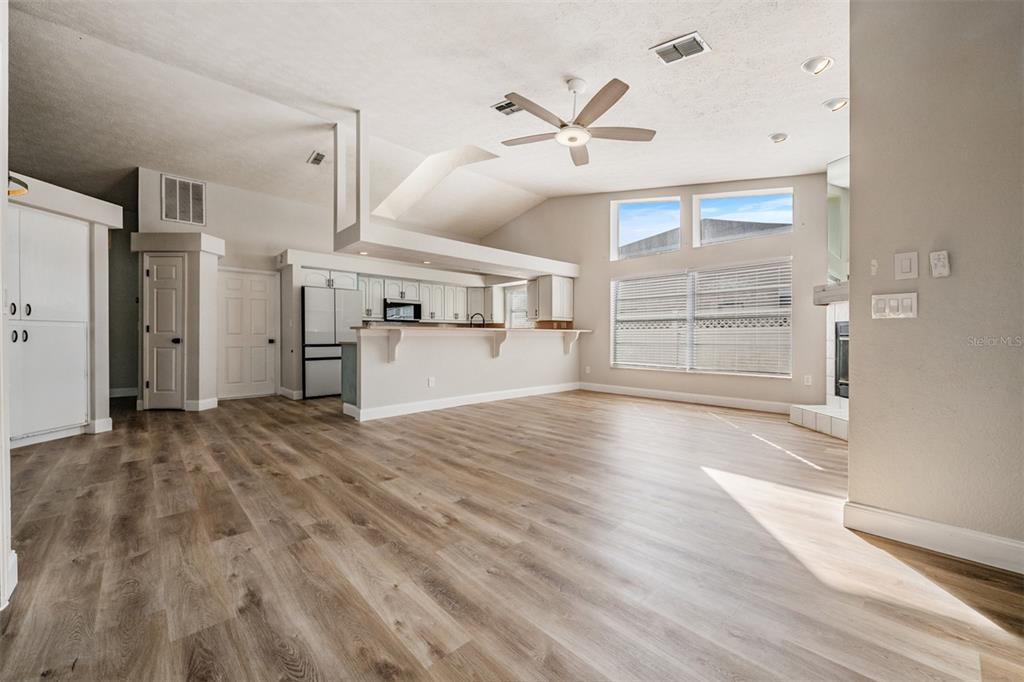 5315 Saltamonte Drive New Port Richey, FL 34655 - Photo 10 of 26 a view of empty room with wooden floor and window