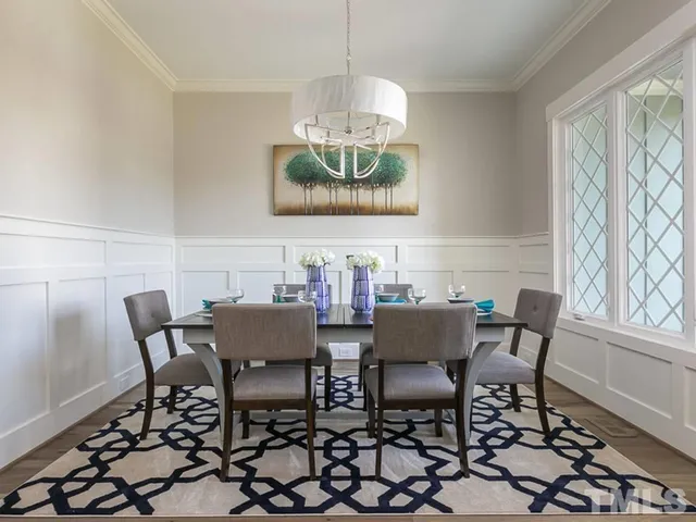 a view of a dining room with furniture and window