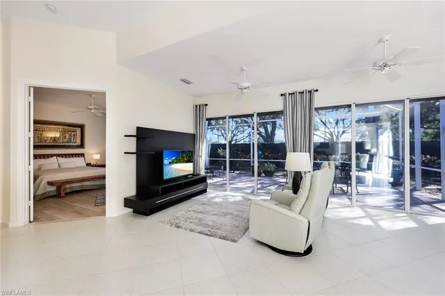 a bedroom with a bed couch and a window