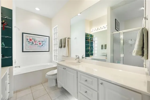 a spacious bathroom with a sink and a mirror
