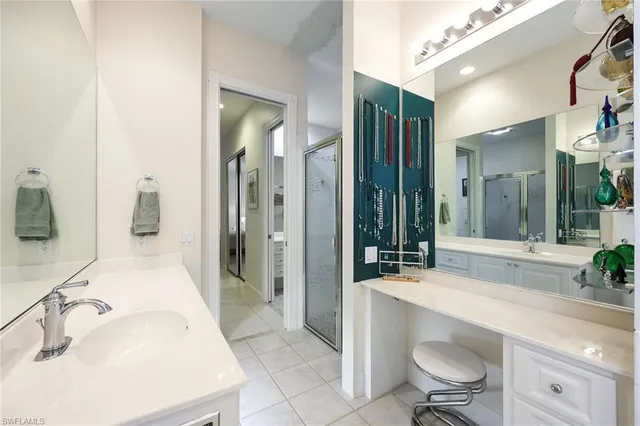 a bedroom with a bed and a wall painting