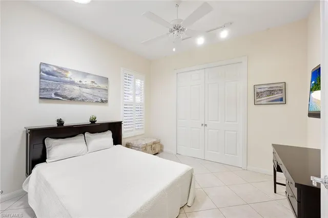 a view of a livingroom with workspace and a window
