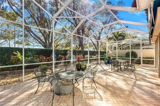 a view of a chairs and table in patio