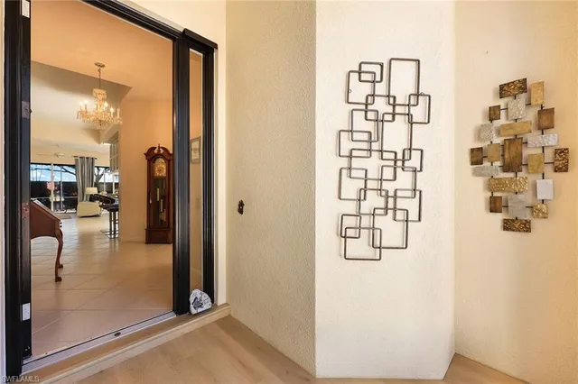 a view of a livingroom with furniture and chandelier