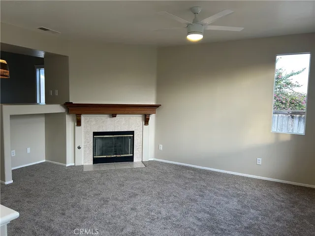 a view of empty room with a fireplace