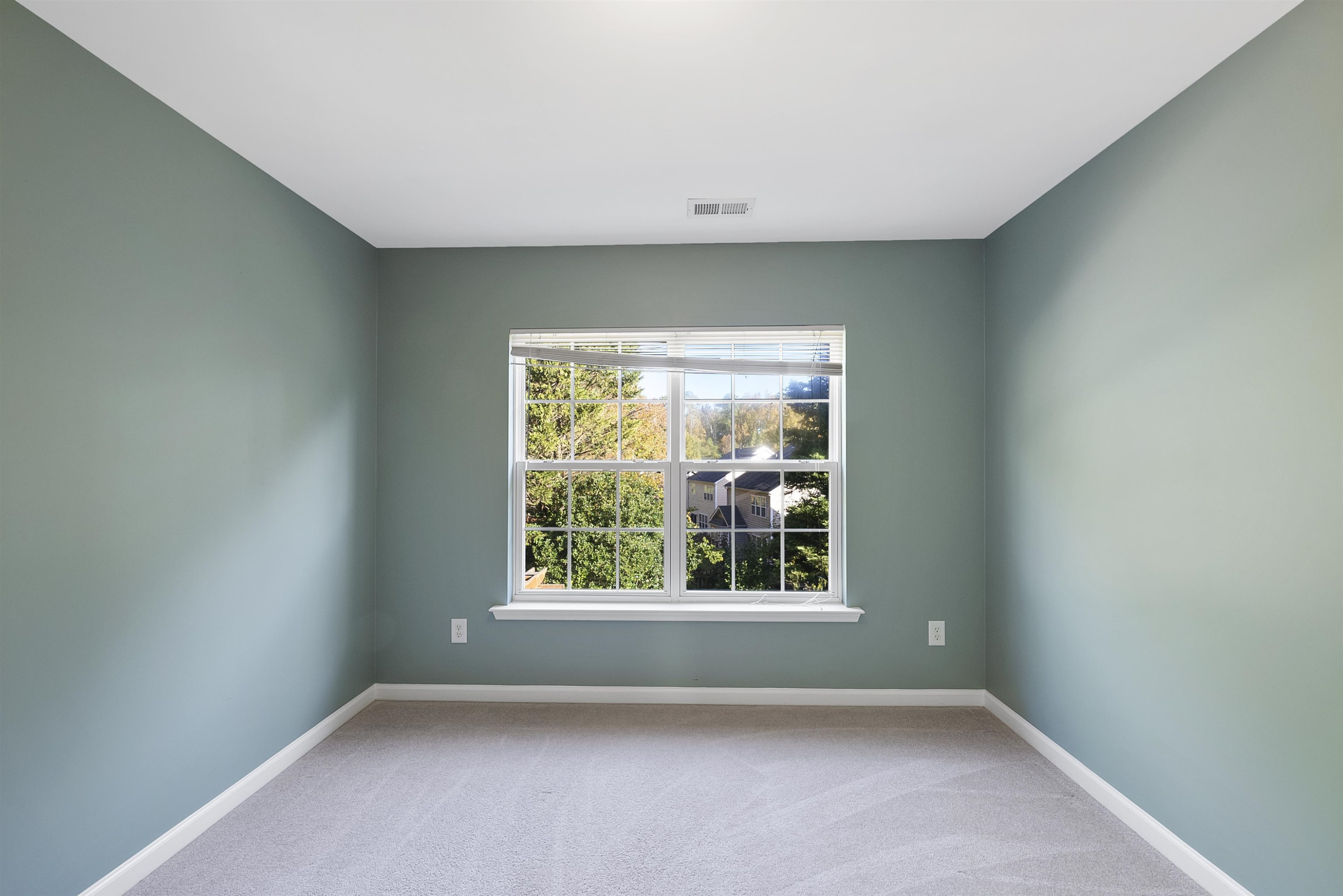 8408 Tie Stone Way Raleigh, NC 27613 - Photo 23 of 33 an empty room with windows