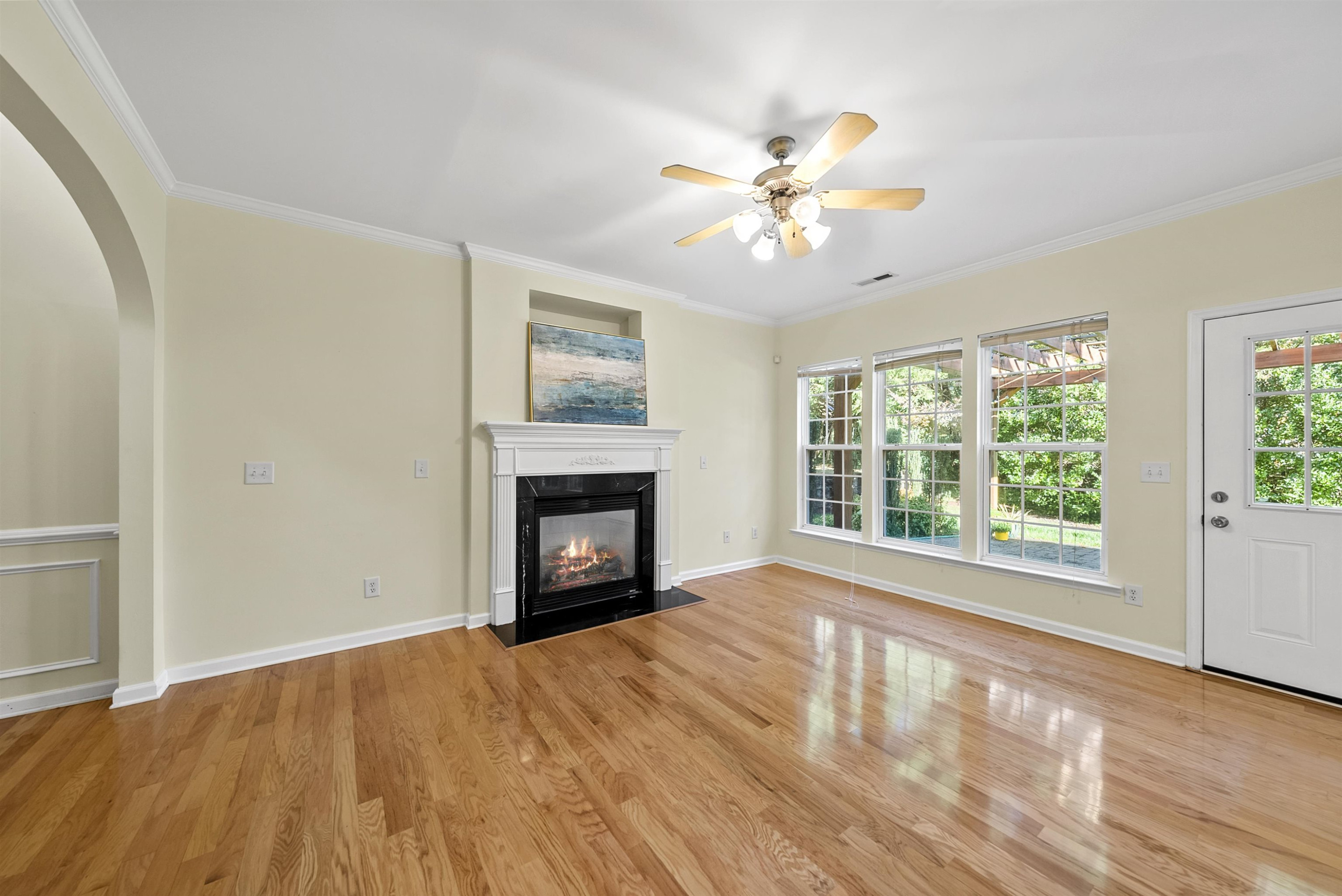8408 Tie Stone Way Raleigh, NC 27613 - Photo 7 of 33 a view of empty room with wooden floor and fan