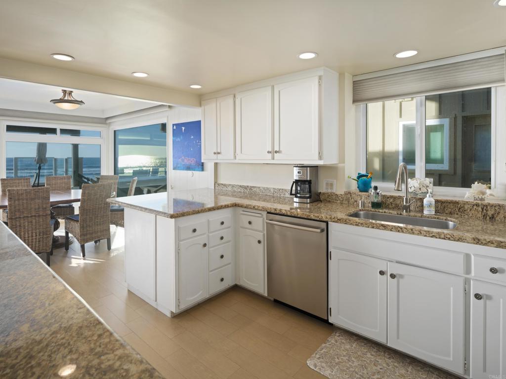 1812 Ocean Front Del Mar, CA 92014 - Photo 11 of 21 a kitchen with sink stove and cabinets
