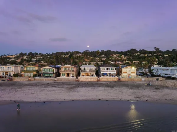an aerial view of beach and ocean