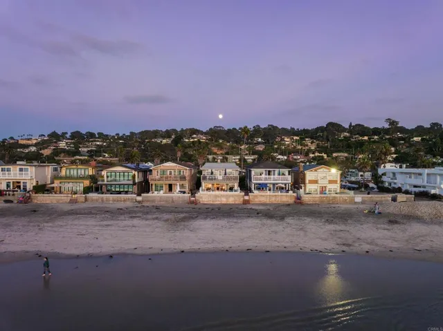 an aerial view of beach and ocean