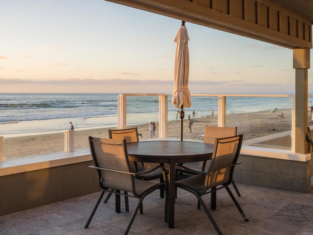 1812 Ocean Front Del Mar, CA 92014 - Photo 3 of 21 a view of an outside dining room with furniture and window