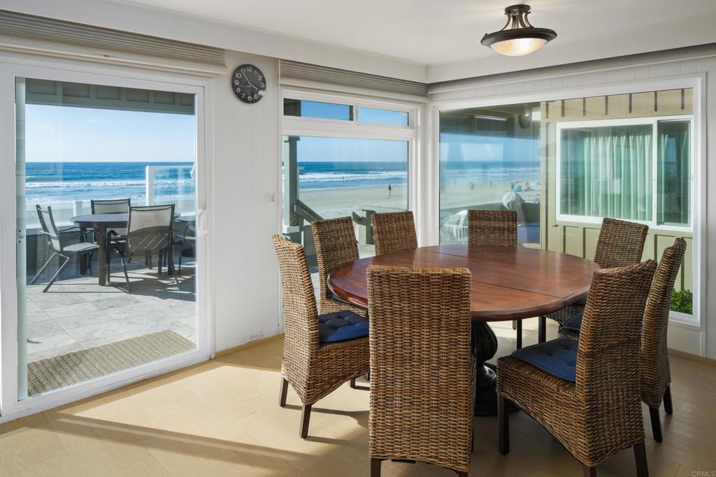 1812 Ocean Front Del Mar, CA 92014 - Photo 7 of 21 a view of a dining room with furniture and a window