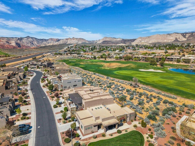 5010 Escapes Drive St. George, UT 84770 - Photo 32 of 46 Aerial perspective of suburban area featuring a local golf course and a water and mountain view